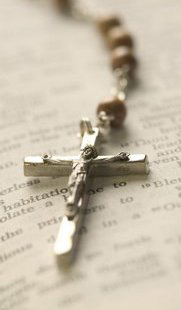 Rosary on Open Bible